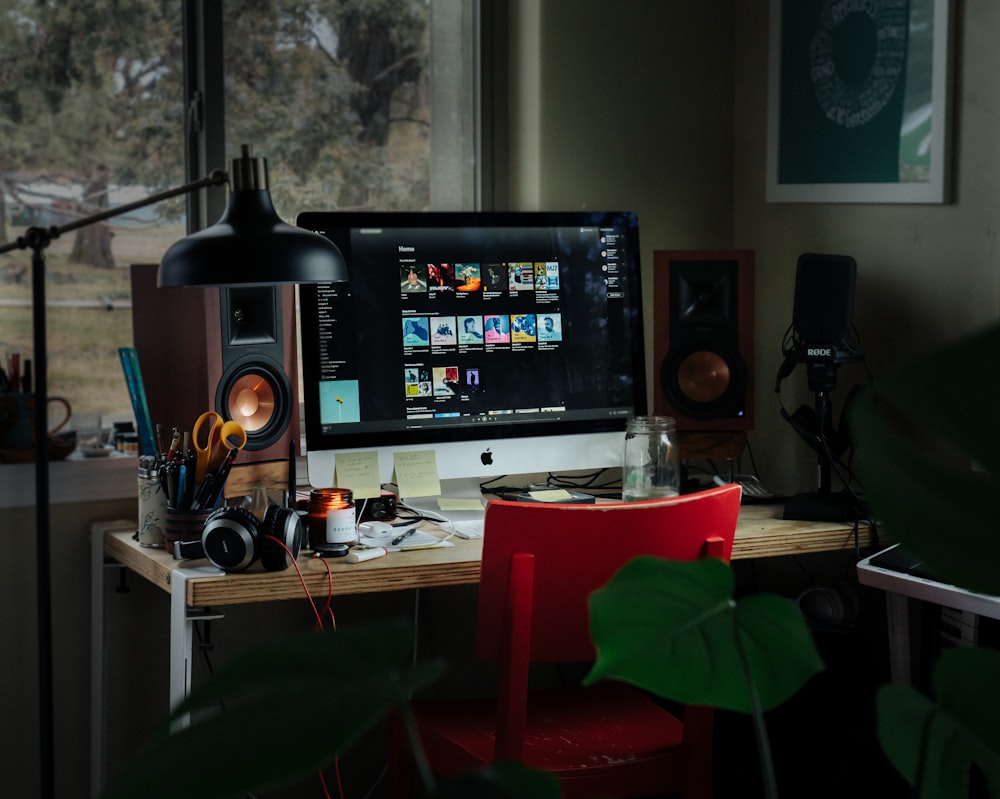 black flat screen computer monitor on brown wooden table