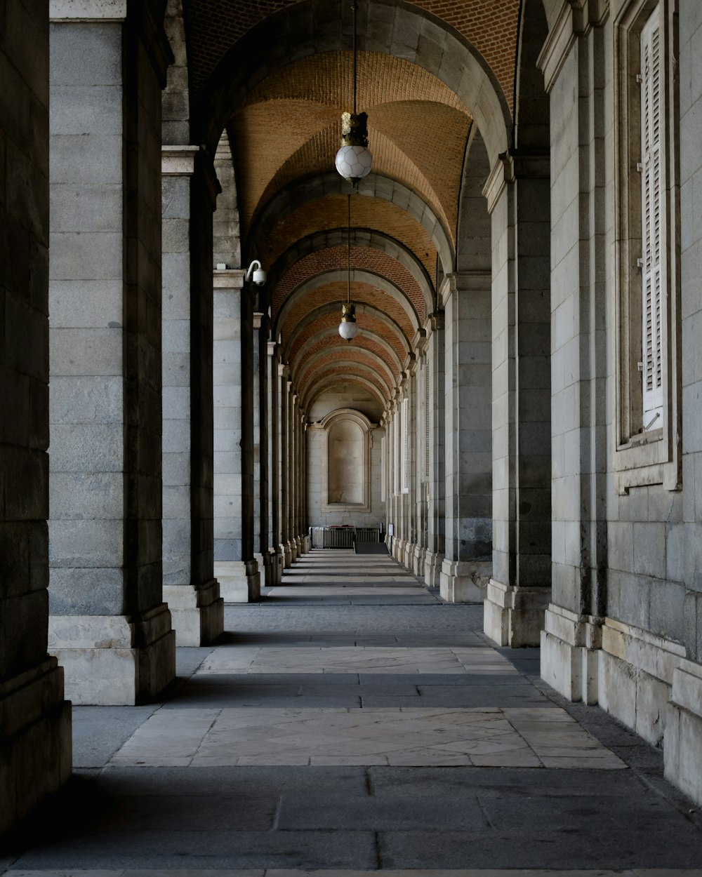 gray and brown concrete hallway