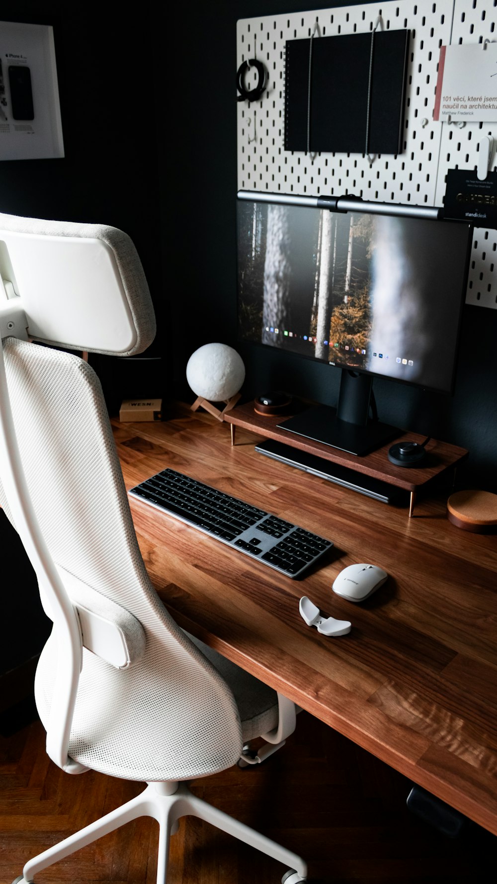 black flat screen computer monitor on brown wooden desk