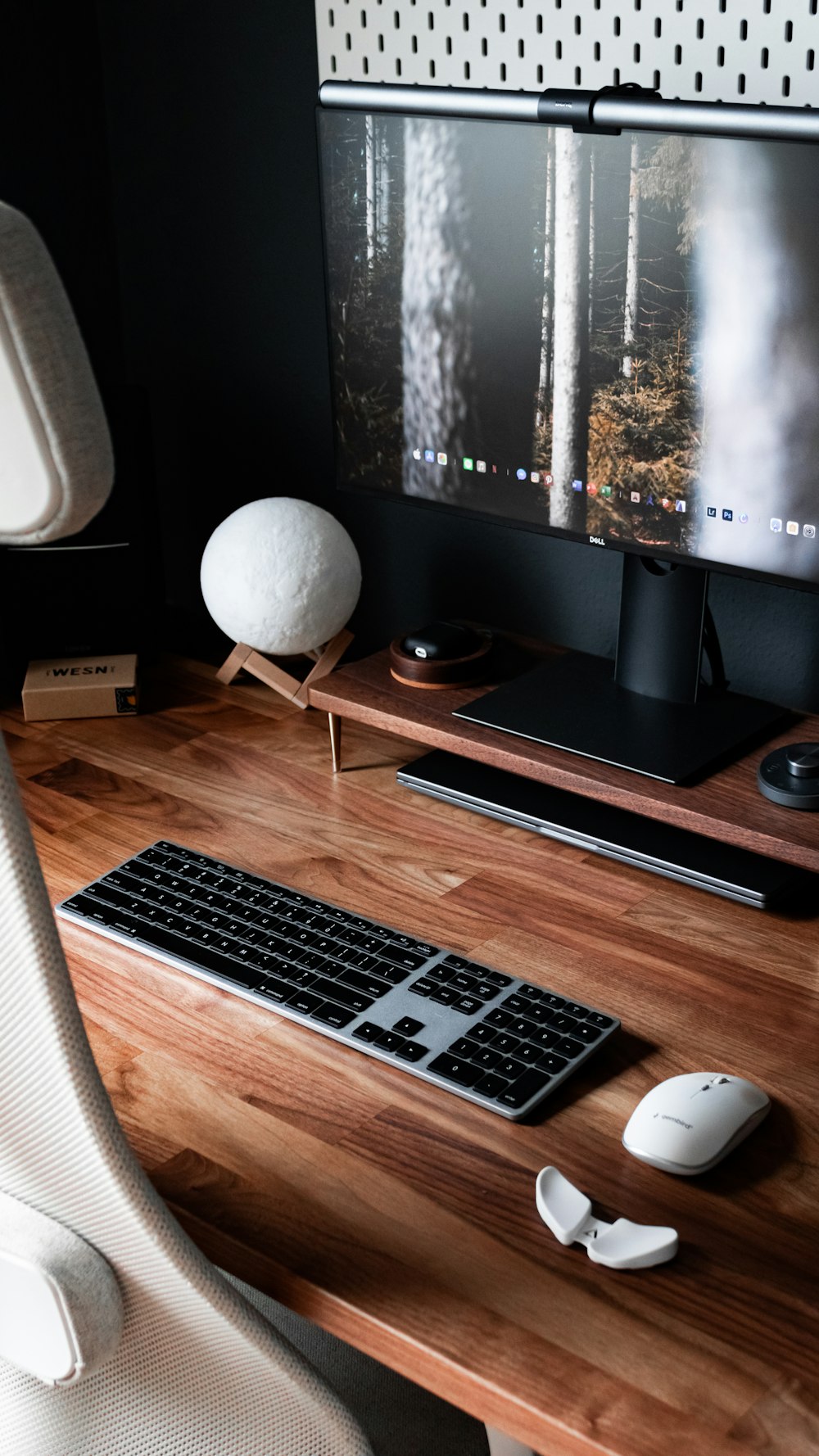 silver macbook pro on brown wooden desk