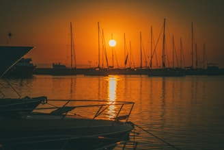 Sunset view over the marina with boats resting quietly on the water.