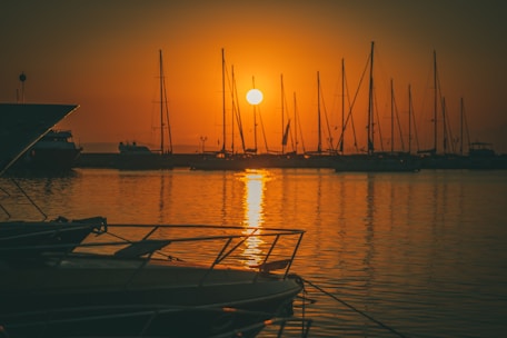 Sunset view over the marina with boats resting quietly on the water.