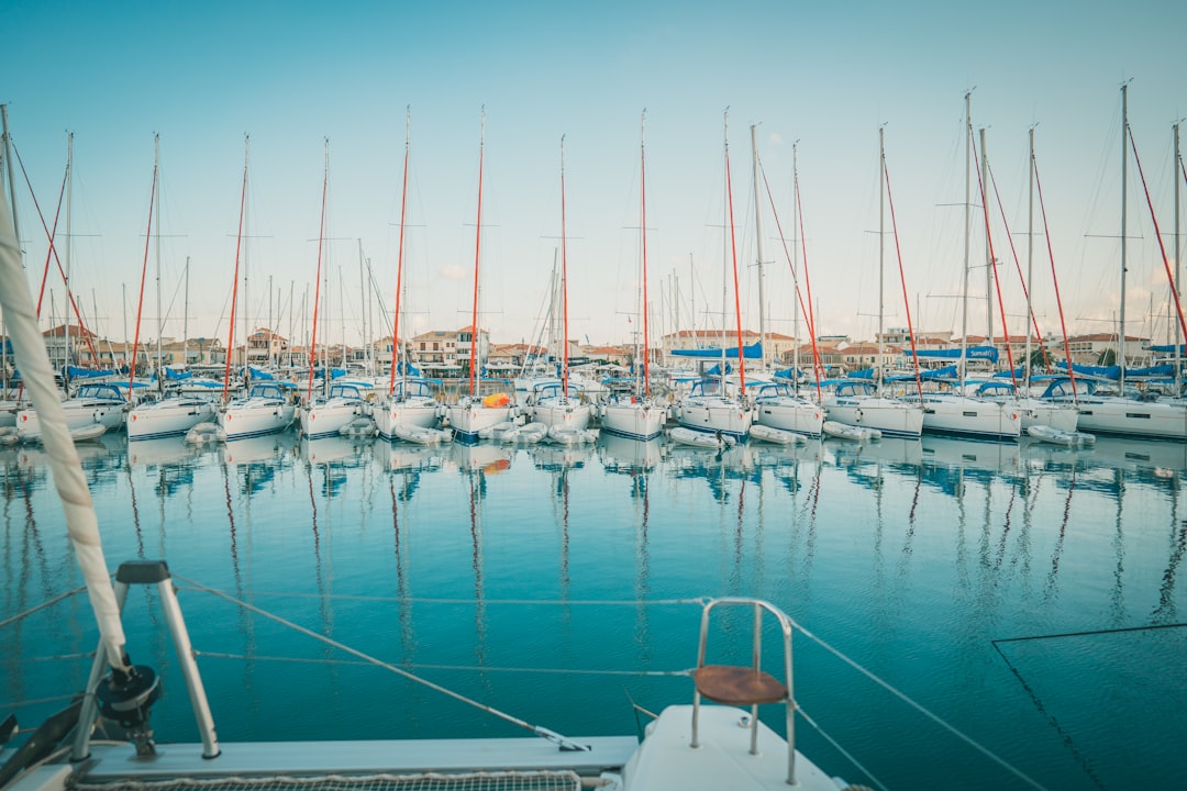 white and blue boat on sea during daytime