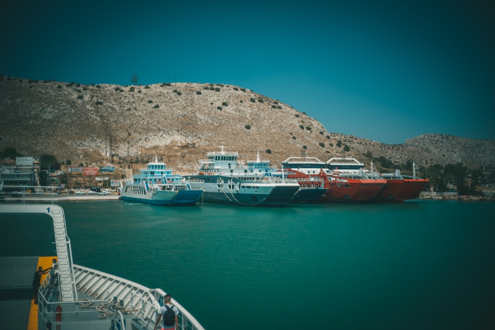 white and red boat on sea during daytime