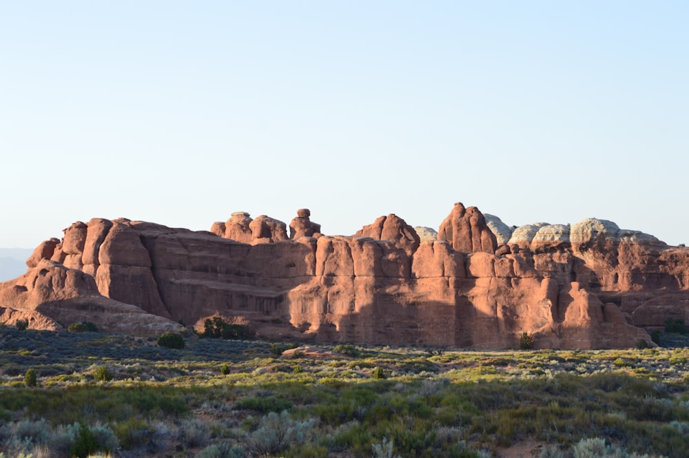 brown rock formation under blue sky during daytime