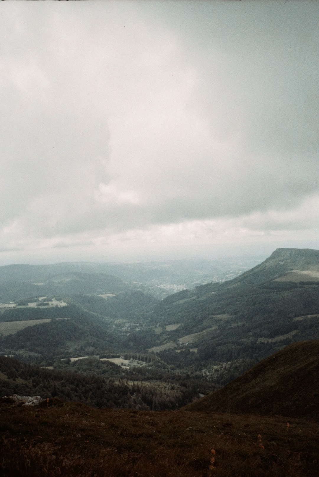 green mountains under white clouds during daytime