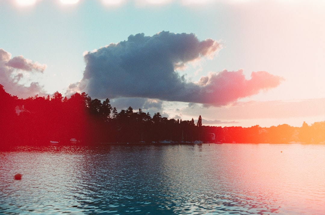 body of water under cloudy sky during daytime