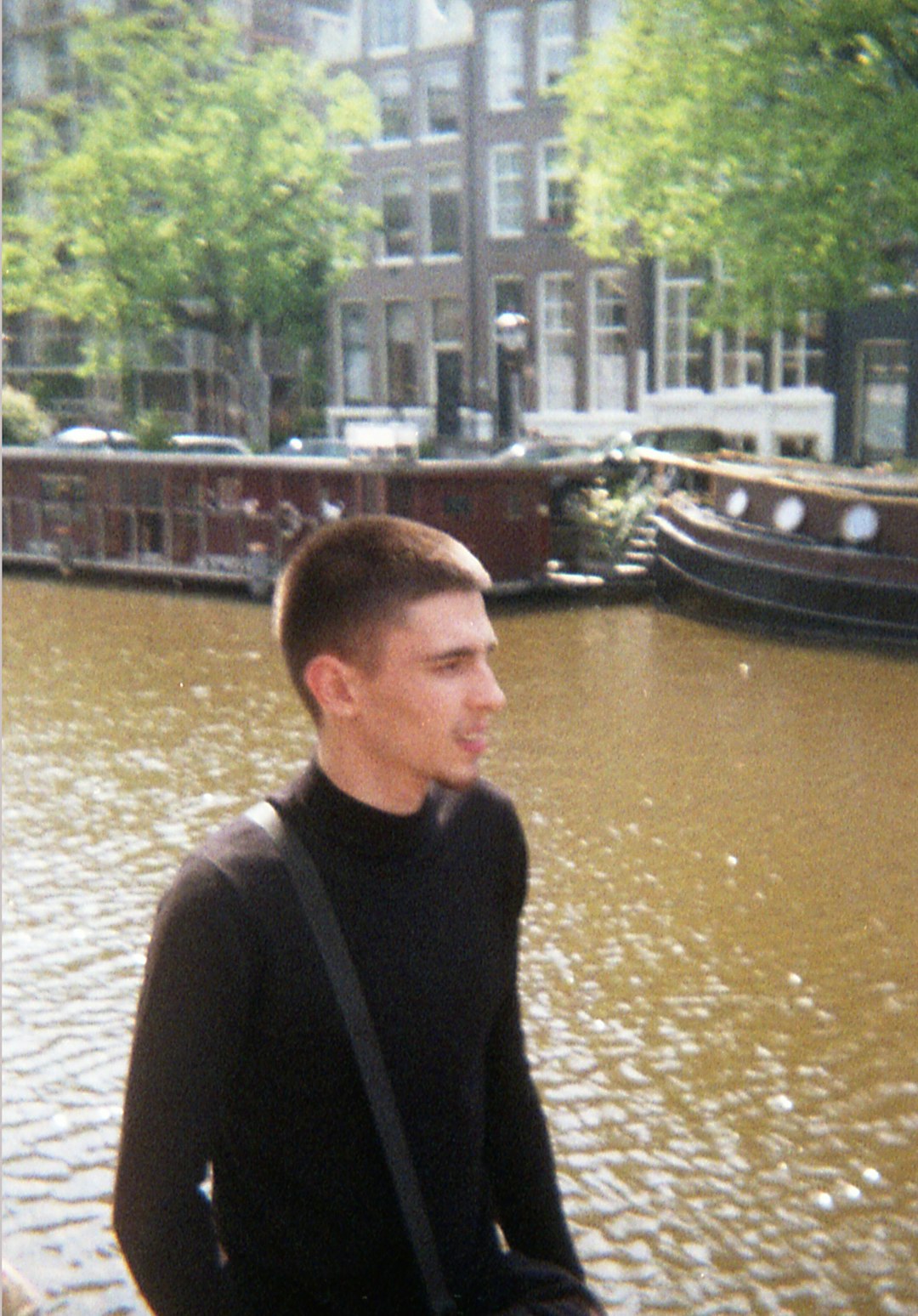 man in black jacket standing near river during daytime