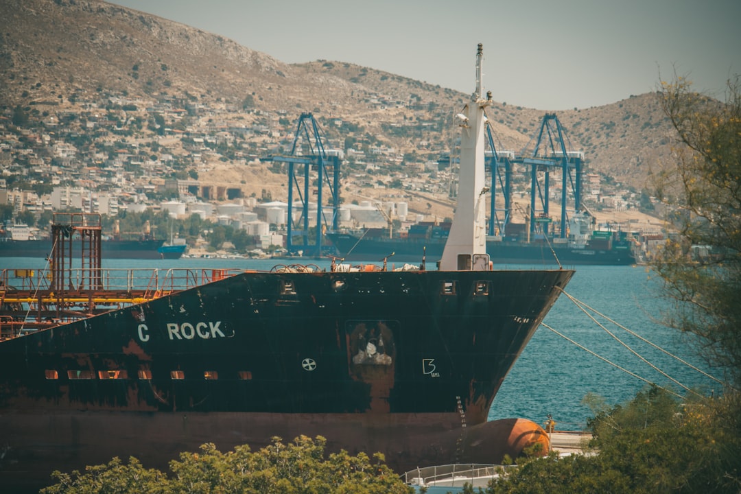 black ship on sea during daytime