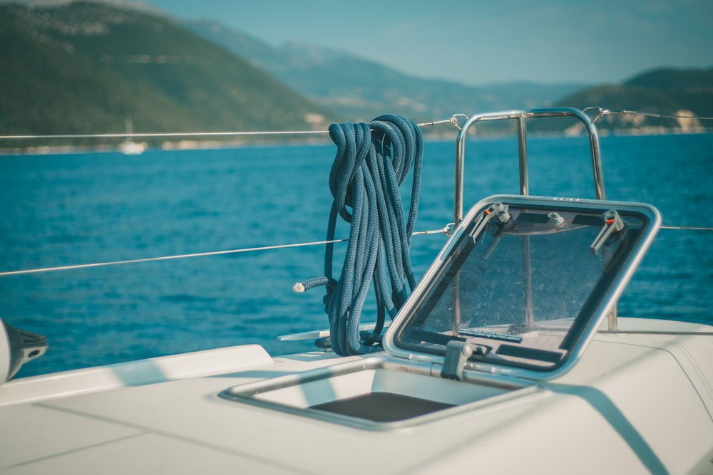 white boat on sea during daytime