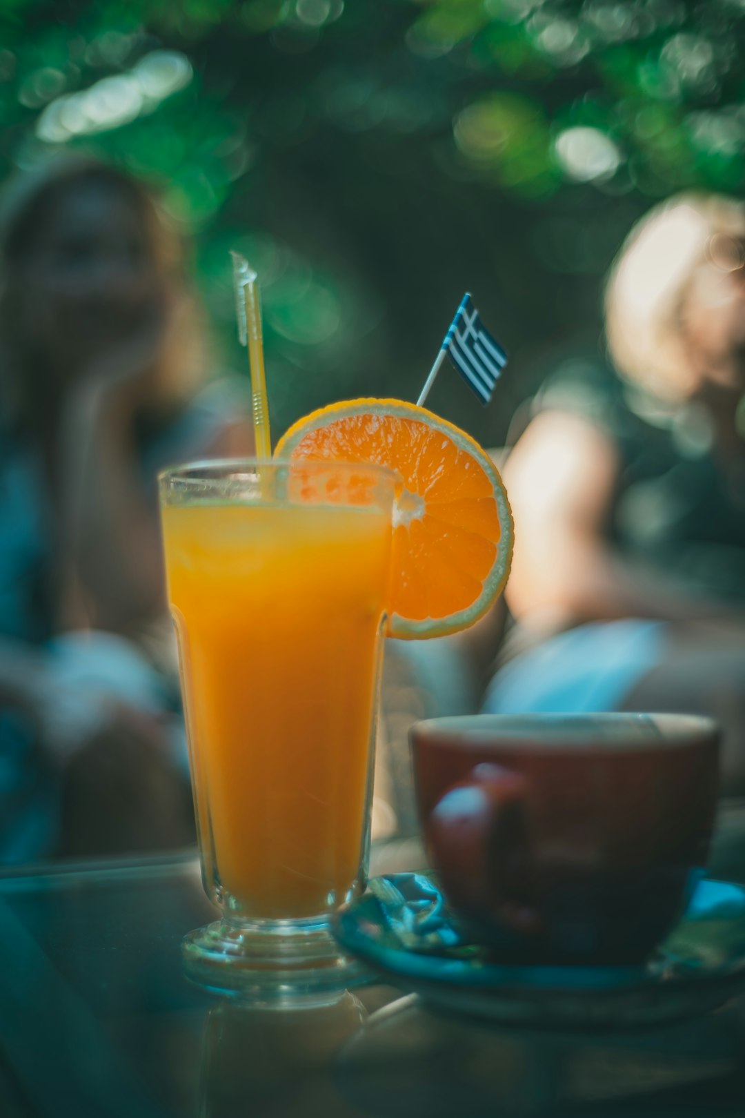 orange juice in clear drinking glass