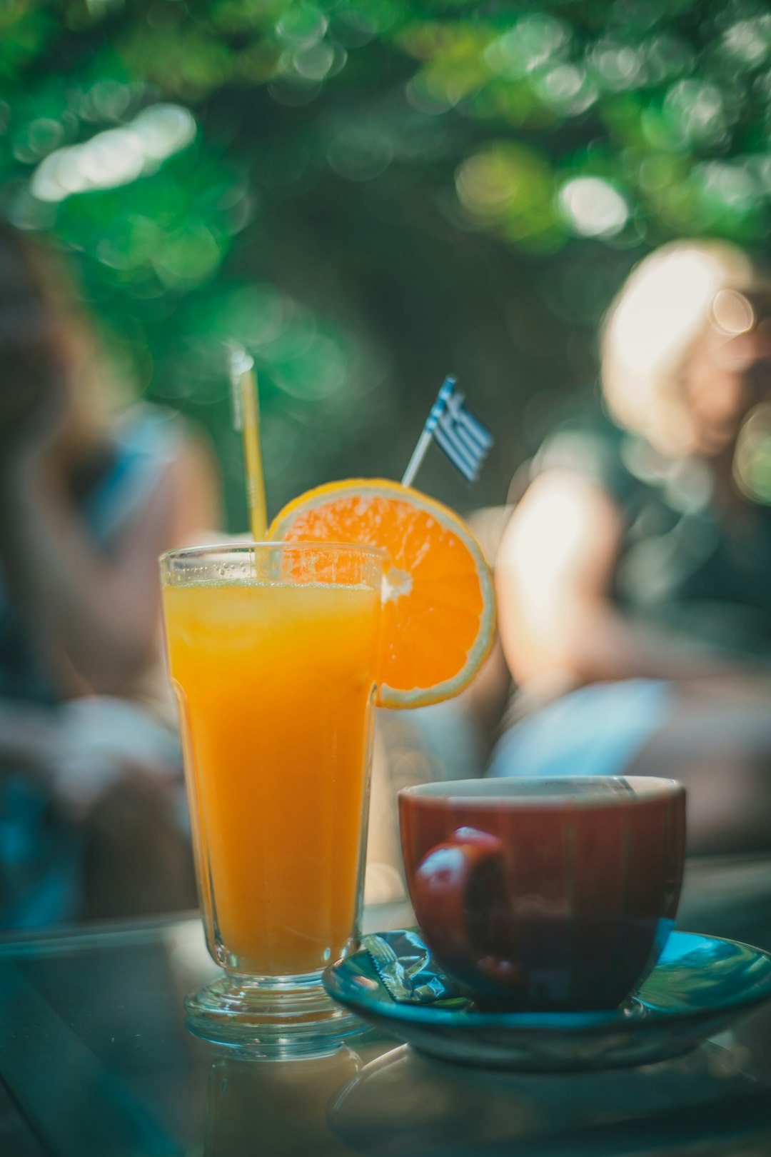 orange juice in clear drinking glass