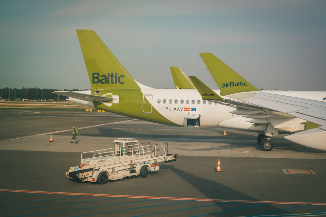 white passenger plane on airport during daytime