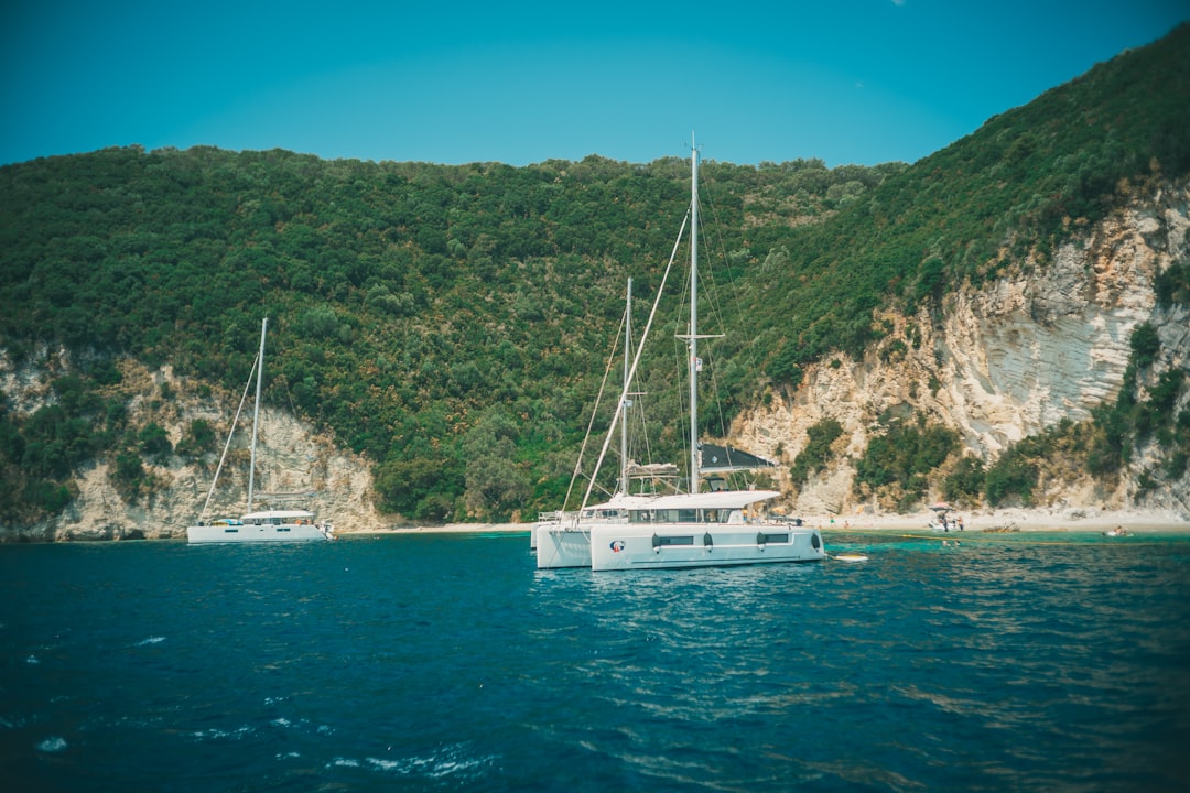 white boat on blue sea during daytime