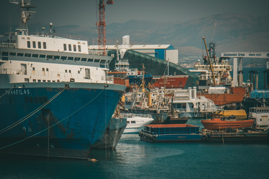 blue and white ship on sea during daytime