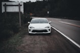white car on road during daytime