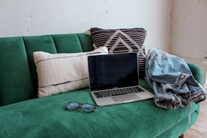 black and silver laptop computer on green table
