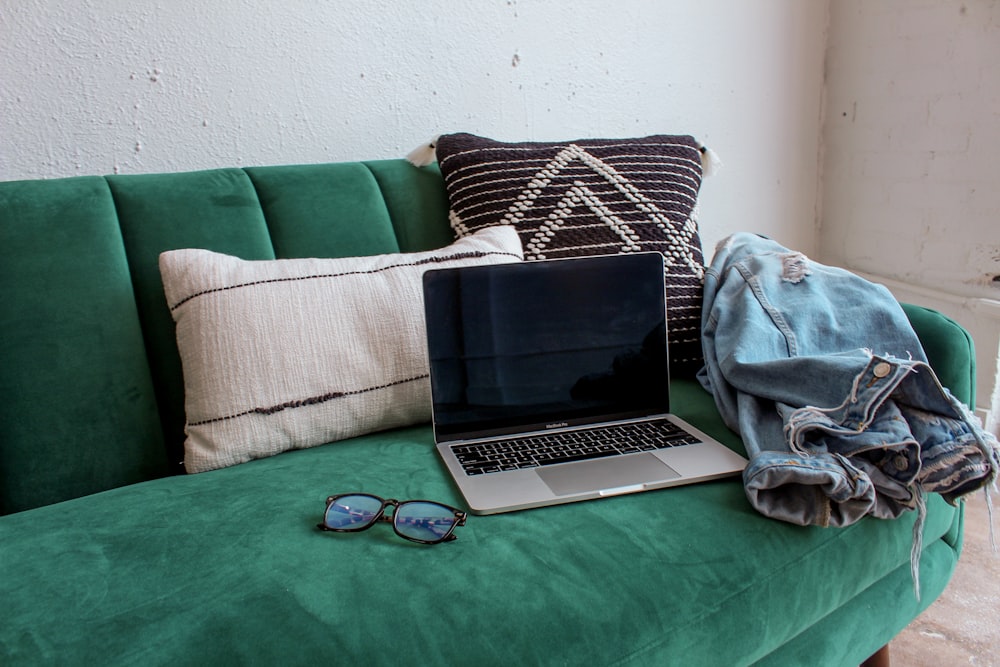 black and silver laptop computer on green table