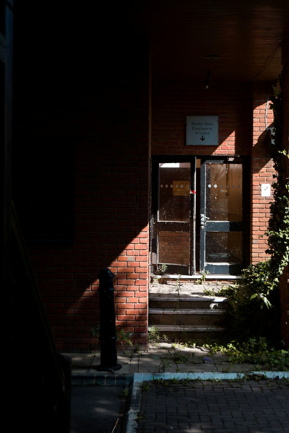 brown brick building with glass window