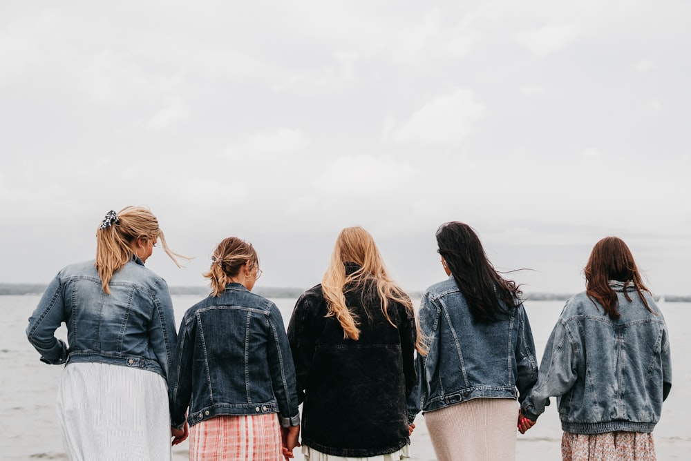 group of people standing on gray concrete floor during daytime