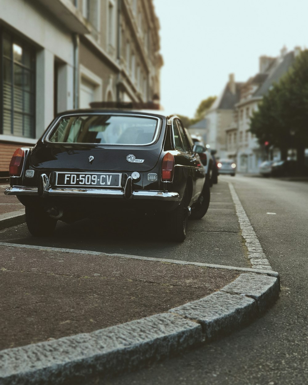 black mercedes benz coupe on road during daytime