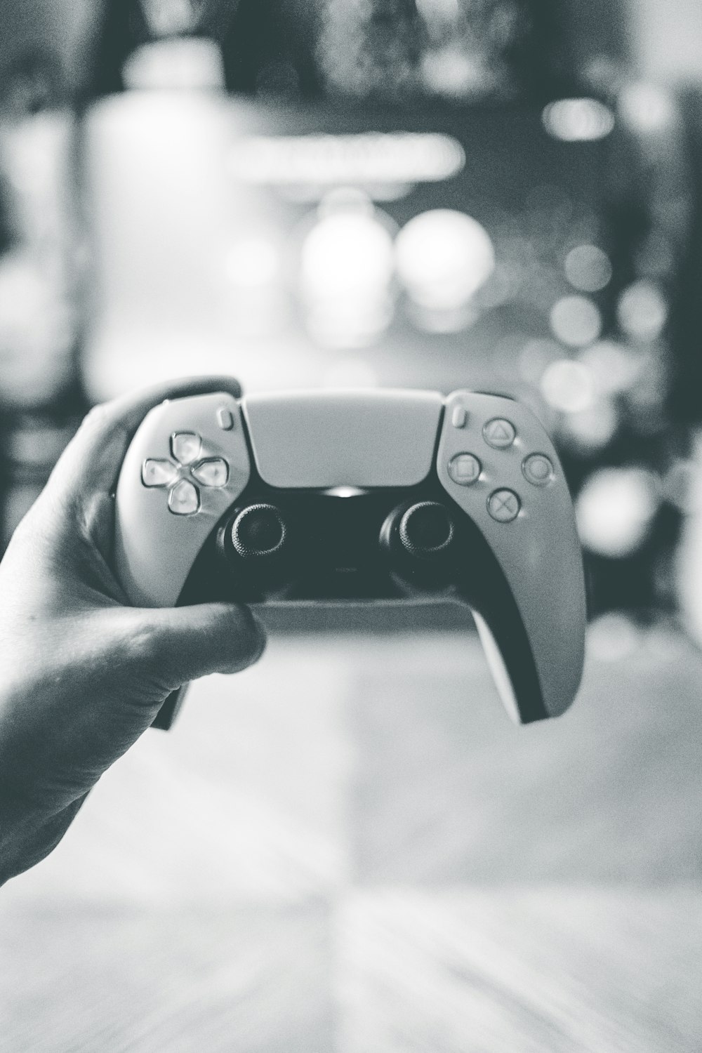 person holding black game controller