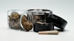 An assortment of cannabis accessories including rolling papers and pipes.
