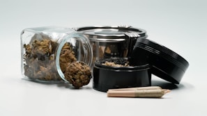 Assortment of cannabis, hash, and coke products displayed with natural props