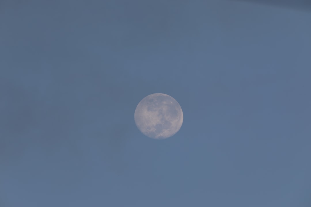 full moon in blue sky