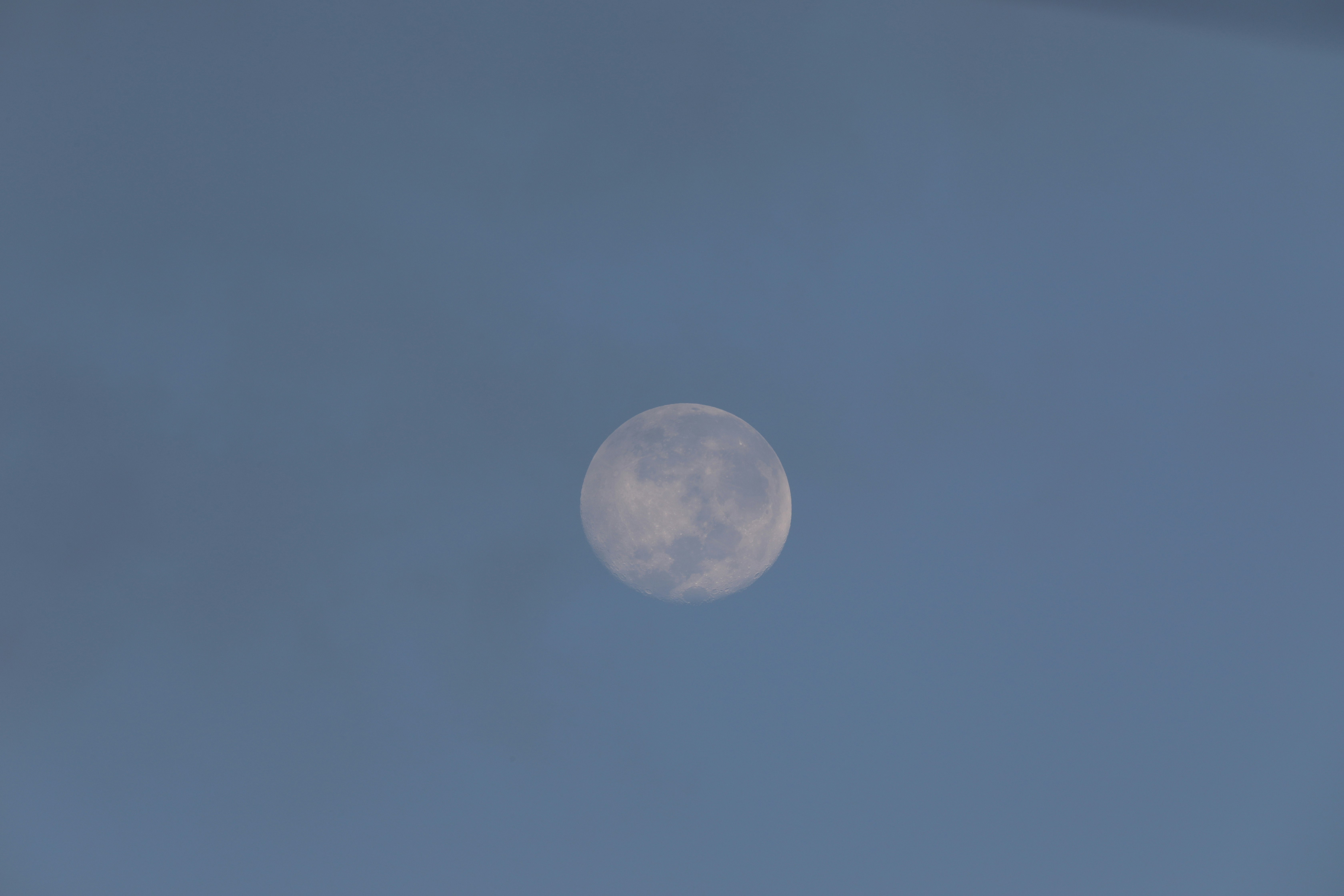 full moon in blue sky