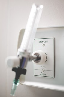 Set of medical oxygen accessories including fluxometers and valves on a white background