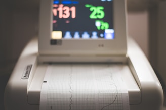 white laptop computer turned on displaying 8 00