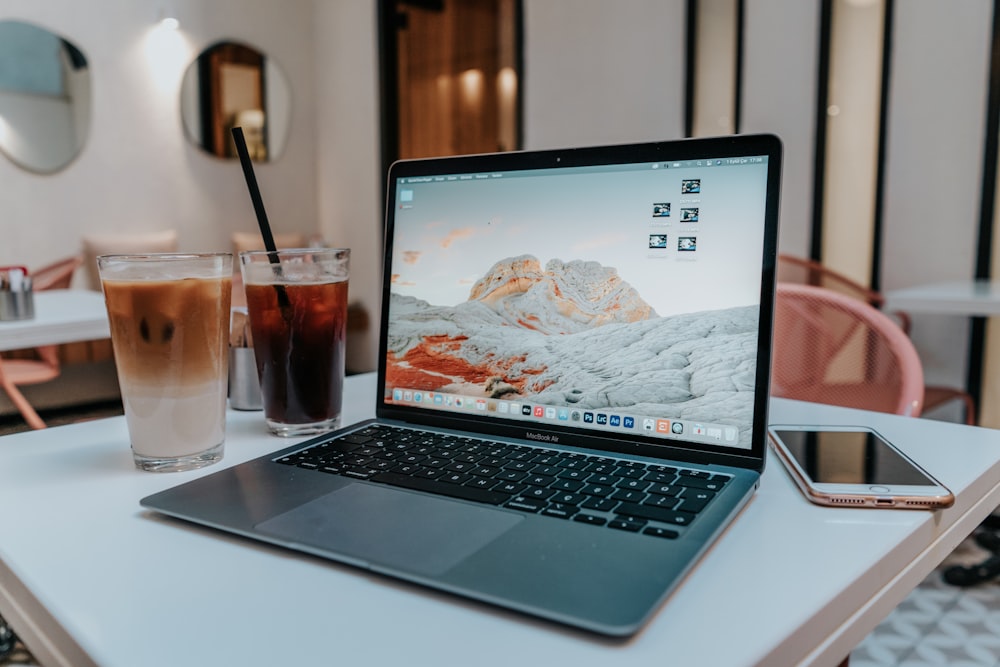 macbook pro on white table