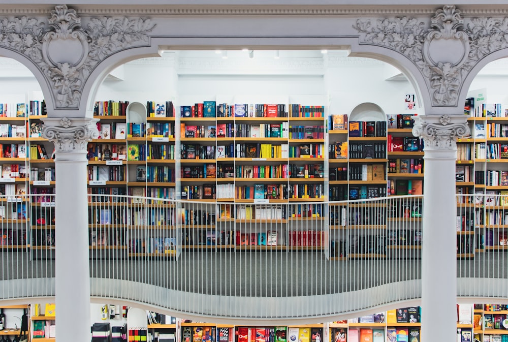 books on white wooden shelf