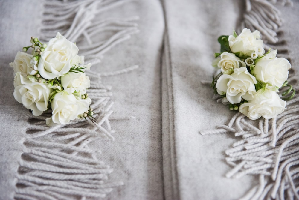 white roses on gray textile