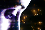 A striking film poster featuring a dramatic close-up of a woman's face illuminated by festival yellow light.