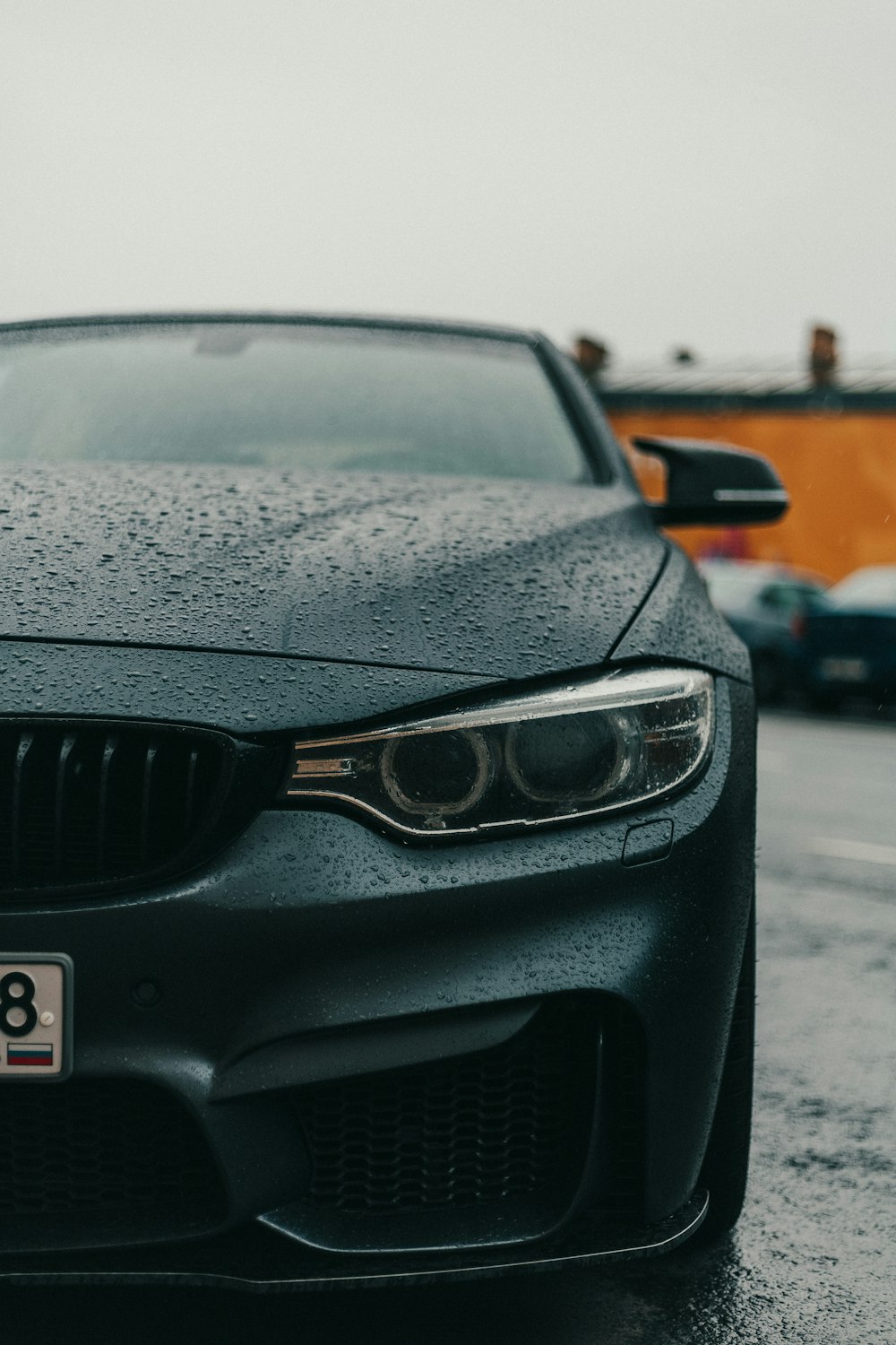 black bmw car on road during daytime