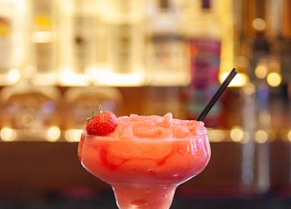 pink ice cream on clear glass