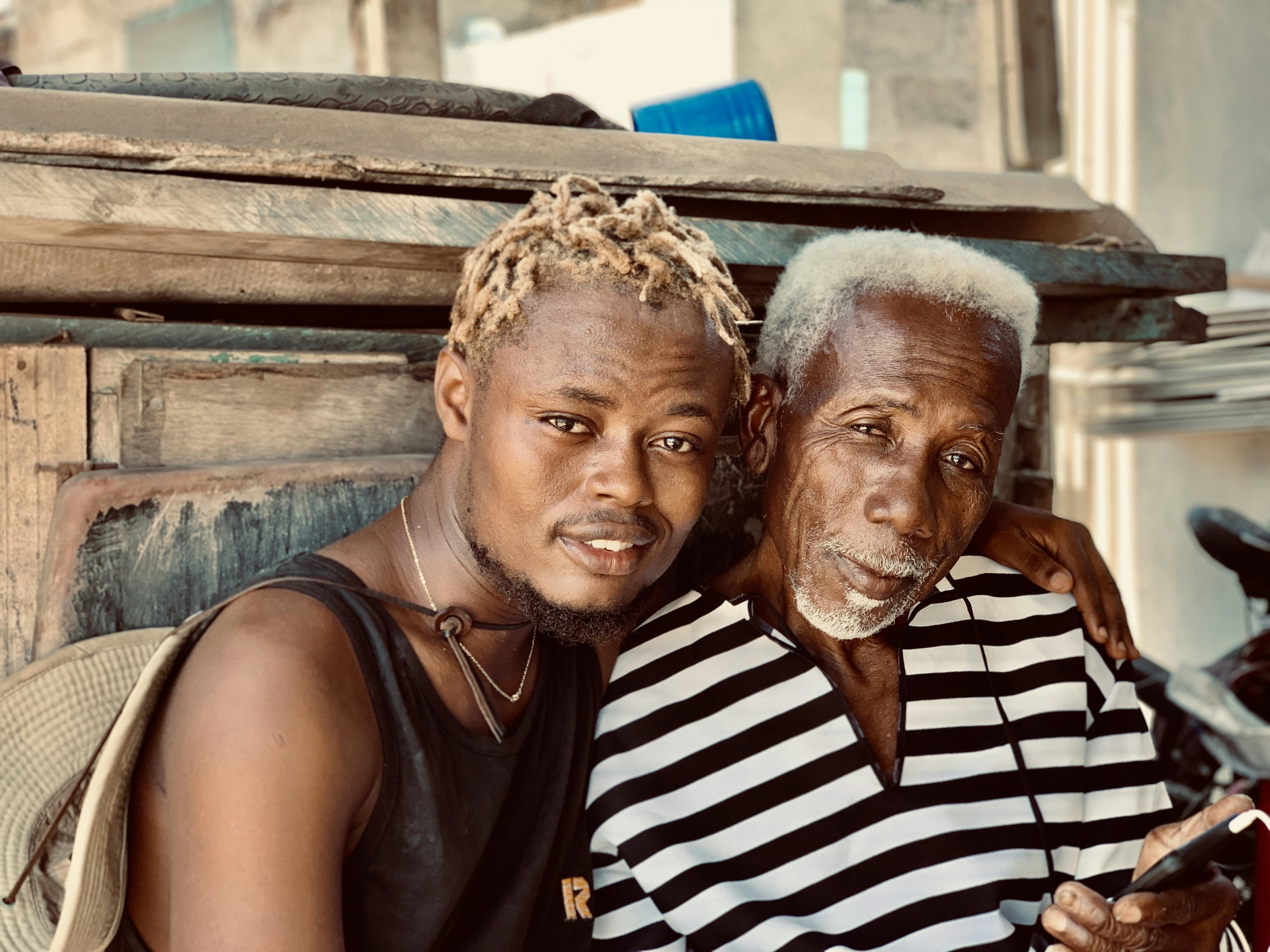 woman in black and white stripe tank top beside man in black tank top
