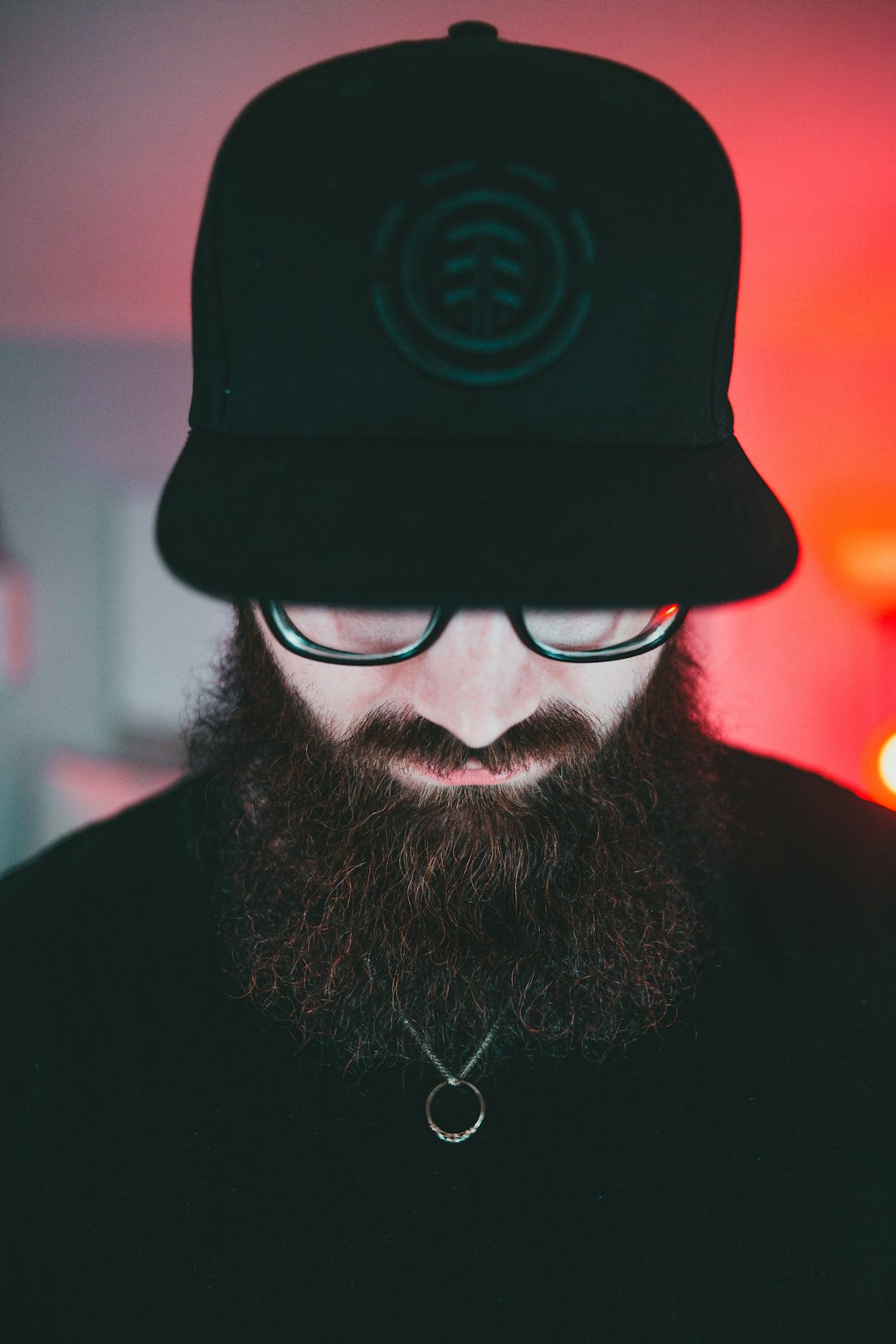 man in black hat and black framed eyeglasses