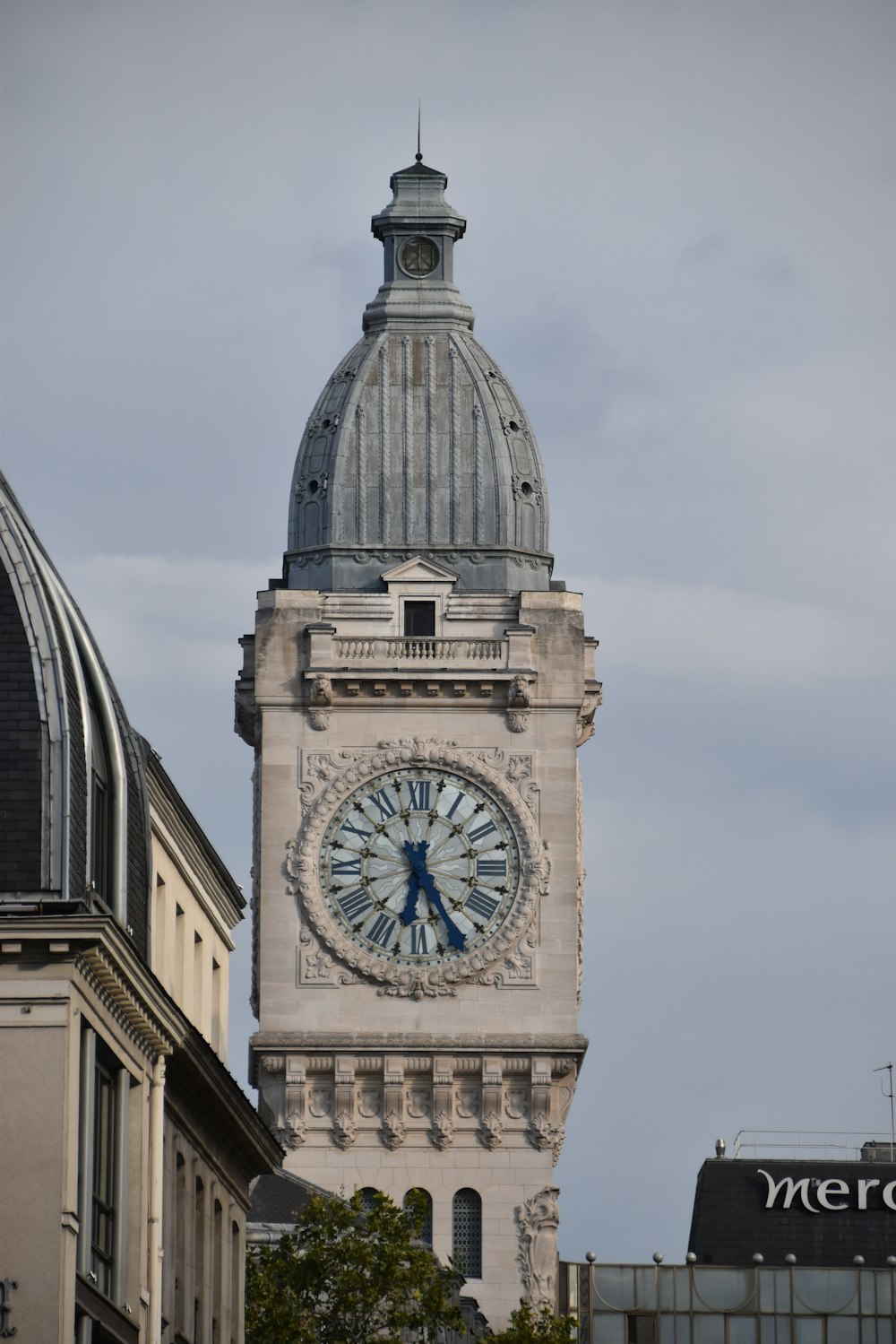 brown and gray concrete building under white clouds during daytime