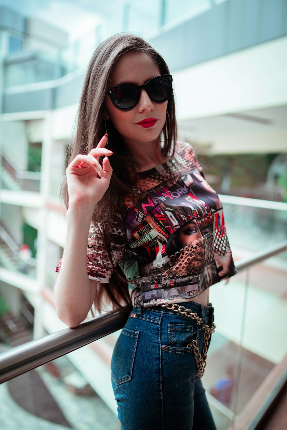 woman in blue denim shorts and black sunglasses