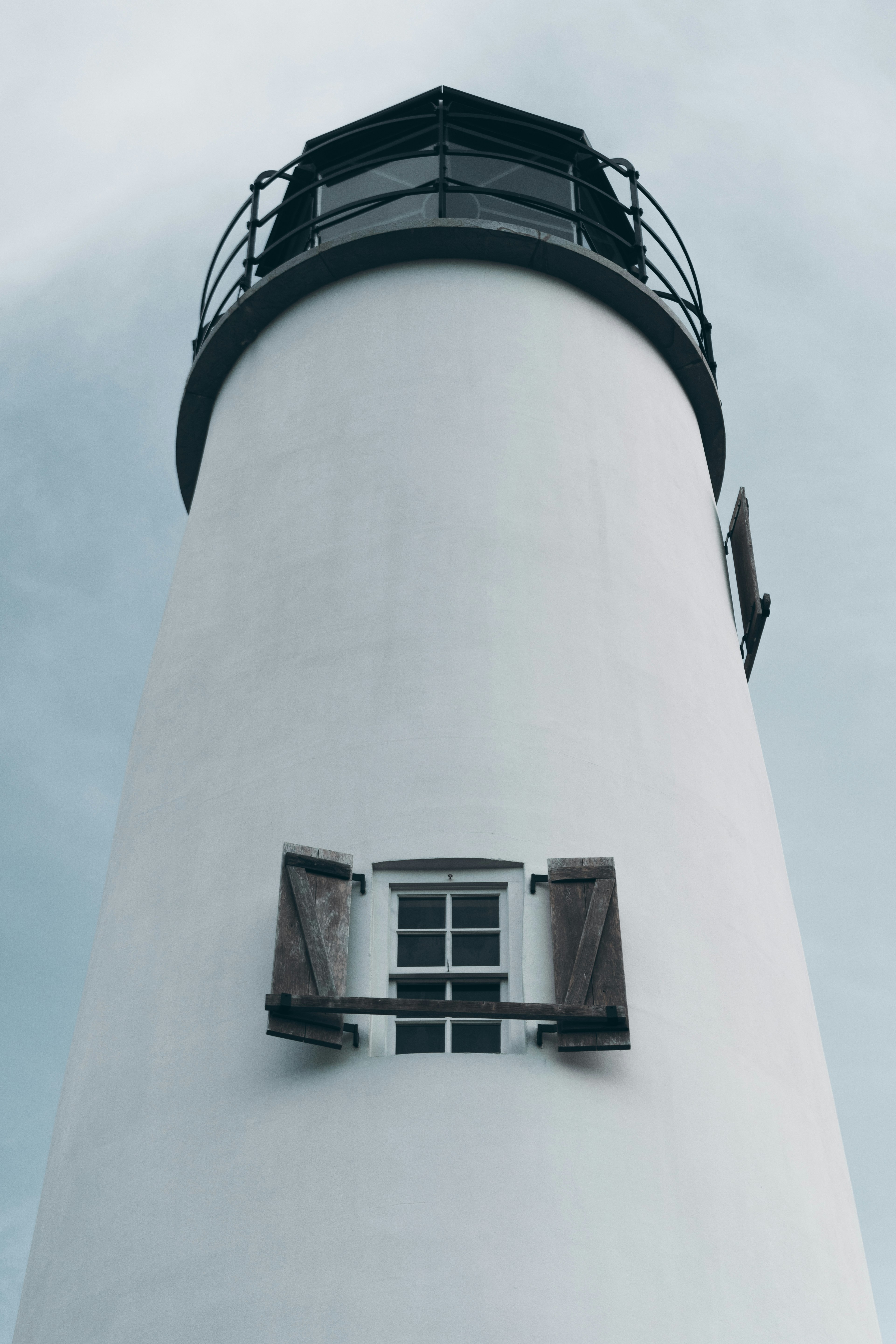 white and black lighthouse during daytime