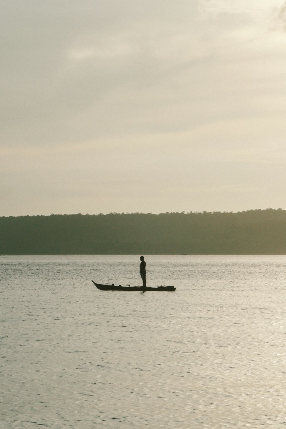 man riding on boat on sea during daytime