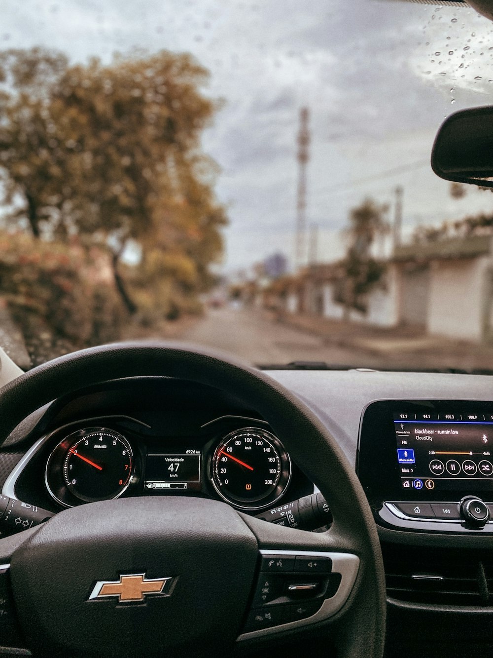 black car steering wheel during daytime