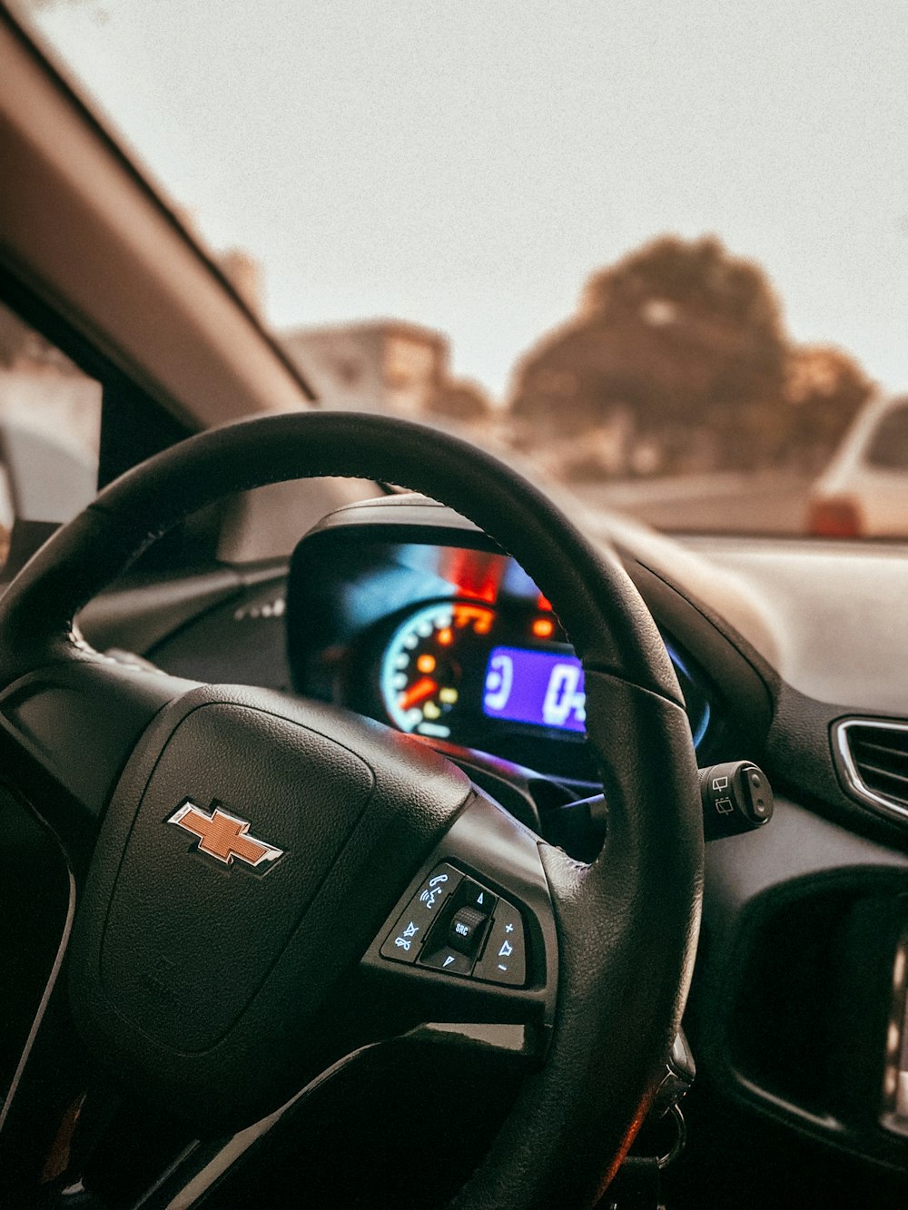 black chevrolet steering wheel during daytime