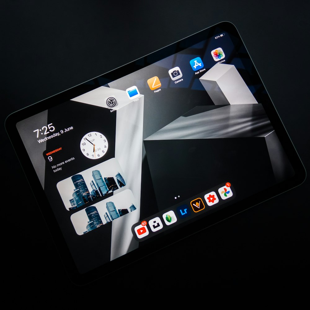 black ipad showing icons on screen