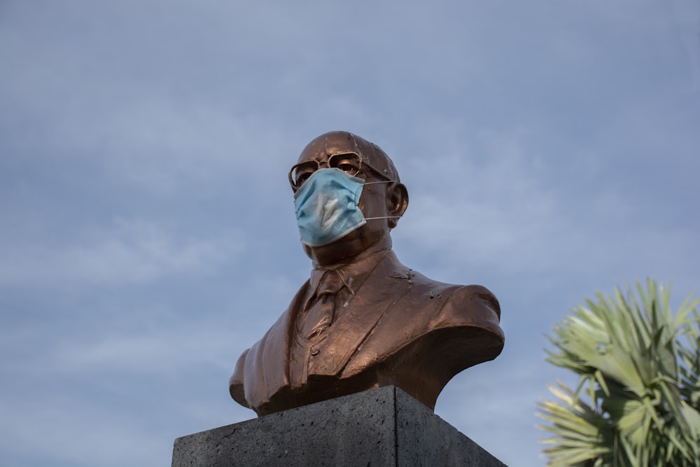 man in black sunglasses statue