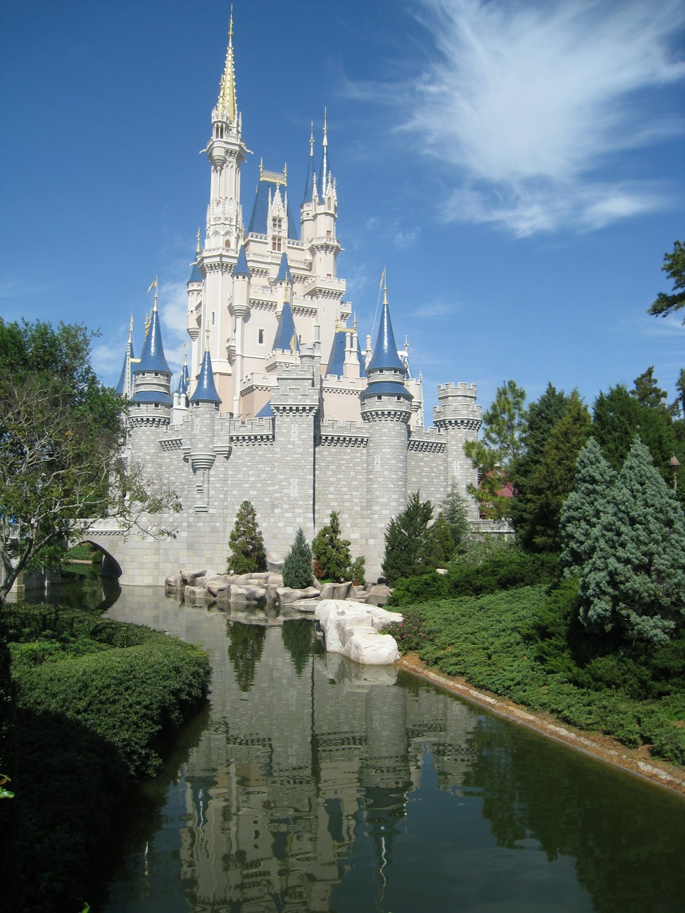 white and blue castle near river during daytime