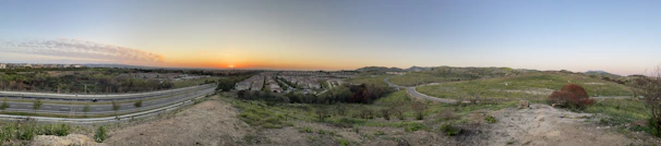 Panoramic view of a completed public infrastructure project at sunset with clear skies.